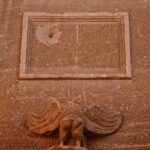 A square shaped object on the side of a building