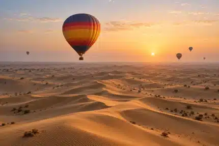 Illustrative hot air balloon flight over the Dubai desert at sunrise