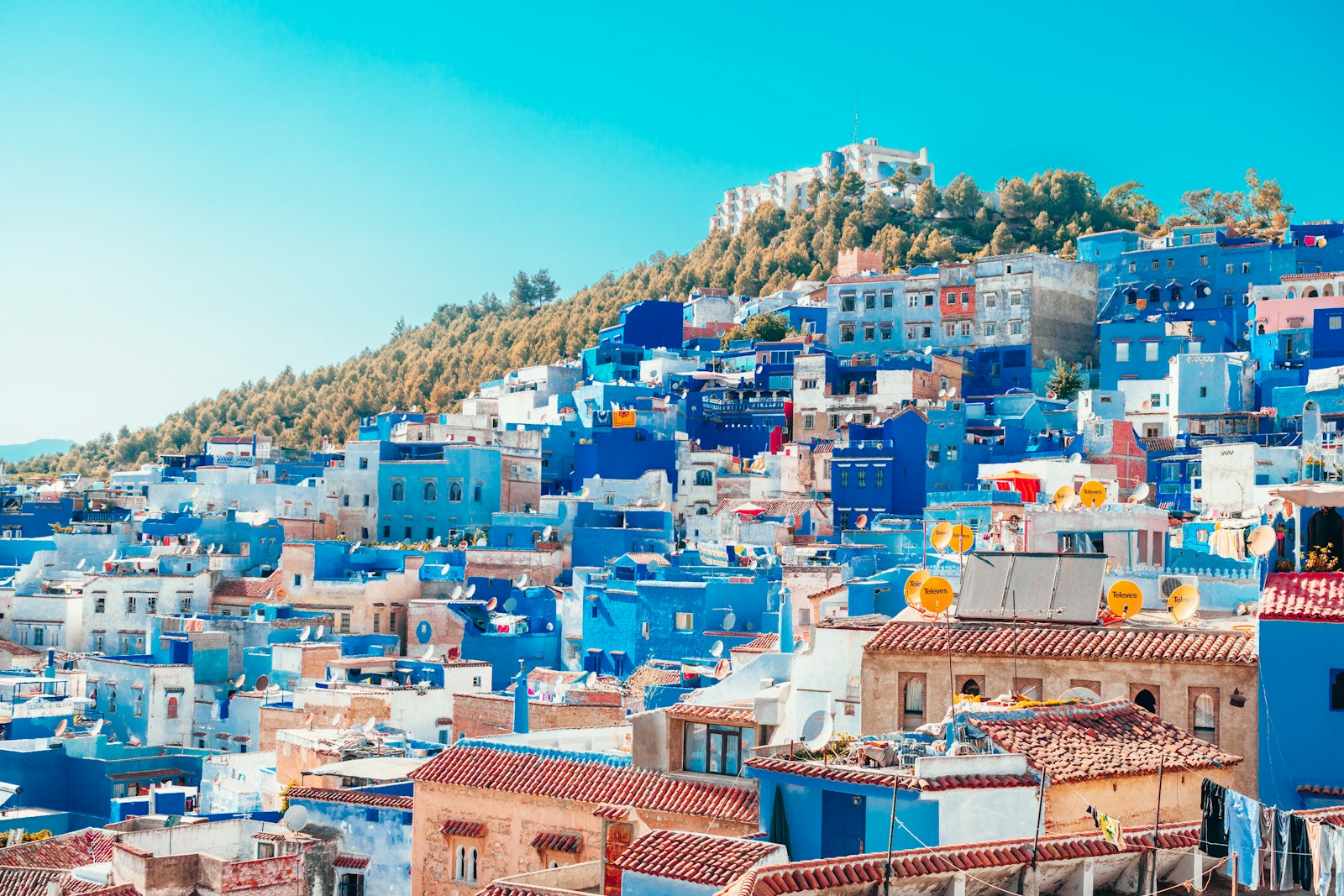 Ramal Tours – chefchaouen blue and white painted houses on the cliff