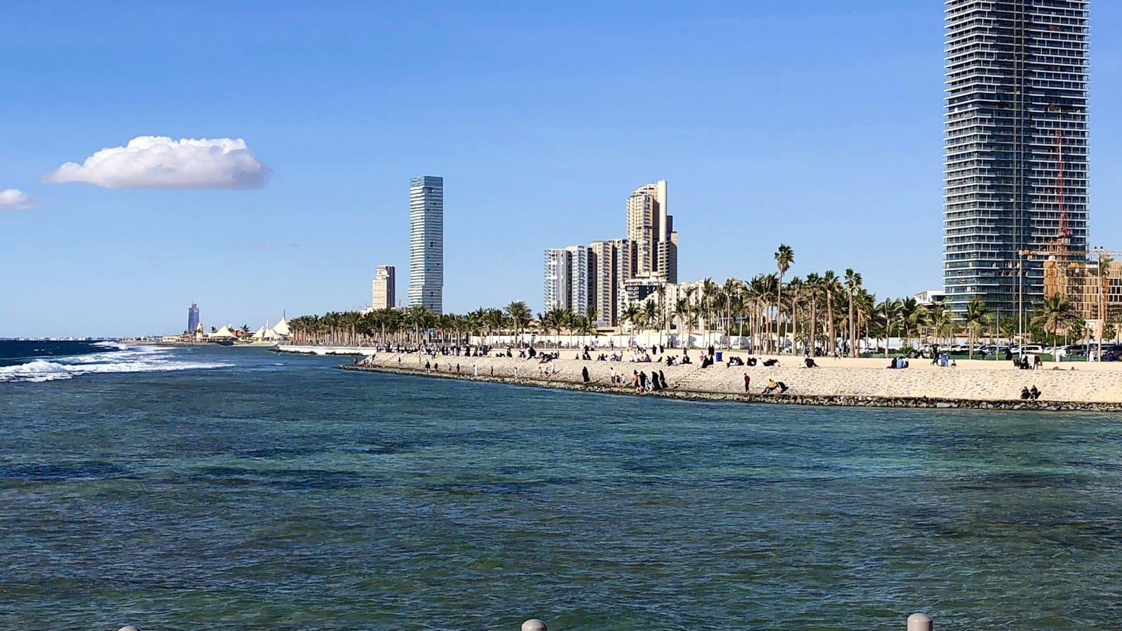 Ramal Tours – jeddah a beach next to a city with tall buildings