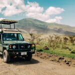black jeep wrangler on dirt road during daytime