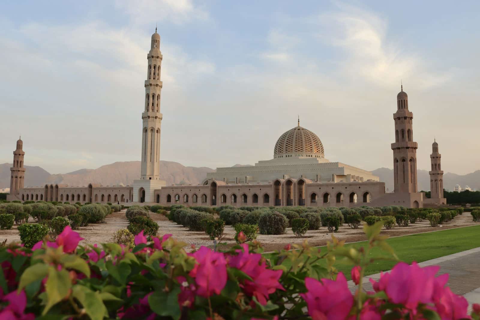 Ramal Tours – salalah a large building with a tower and a clock on it
